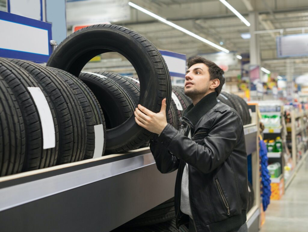 male customer choosing new tires