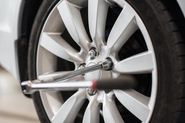 screwdriver and car wheel tire